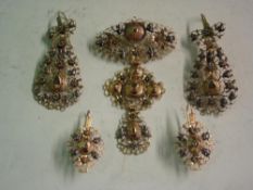 A Suite of Gold Filigree Jewellery Comprising a pendant and two pairs of earrings, all set with