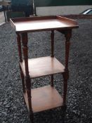 A Victorian Oak Whatnot Of three stages with turned uprights. 44