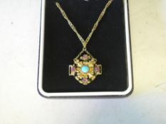 A Gold Openwork Pendant Set with a turquoise and four amethysts. Adapted