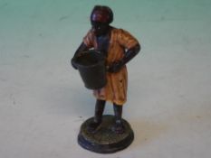 A Cold Painted Metal Figure A North African man with bucket. 3 ¾