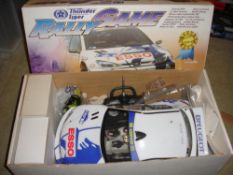 A Thunder Tiger Radio Controlled Rally Car 3.5cc 2 stroke nitro powered engine. 1/8th scale.