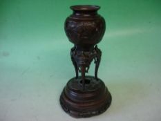 A Japanese Bronze Vase. Meiji. Relief decoration of birds and prunus, raised in mythical beast