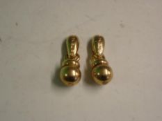 Givenchy A pair of yellow metal pendant drop earrings