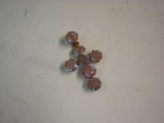 A Cross Pendant With opalescent cut stones set in yellow metal