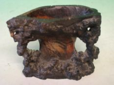 An Oriental Soapstone Brush Water Pot Naturalistically carved with rockwork. 3 ½
