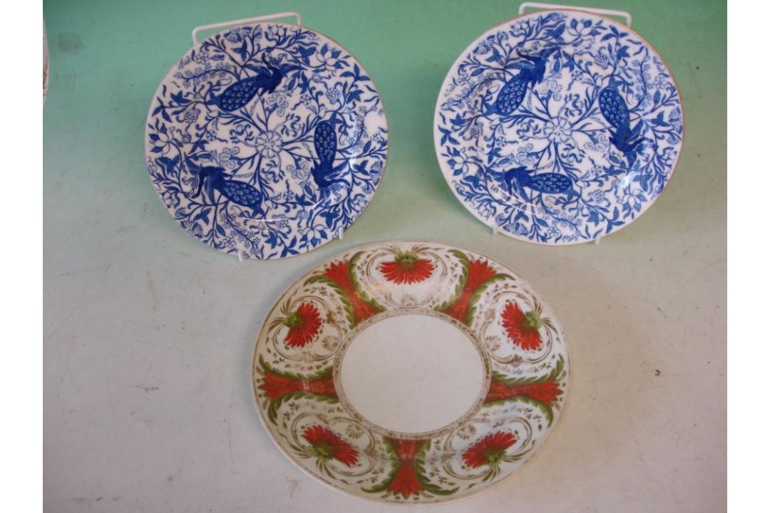 A Pair of Derby Plates Decorated in blue and white with peacocks amid radiating foliage 8" diam. (