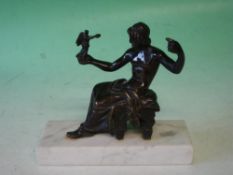 Grand Tour A bronze group of a seated man receiving an offering from an angel standing in his