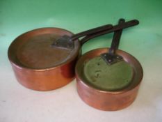 Two copper saucepans With Covers Stamped Temple and Crook. Iron handles. The larger 11 ½