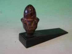 A Bronze Doorstop Modelled as a pineapple with mid brown patination. 19th century. 6 ½