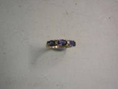 An Amethyst and Diamond Five Stone Ring Marked 375