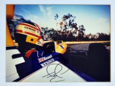 Signed Nigel Mansell Formula One World Champion photograph for Williams, a colour action shot mf&g