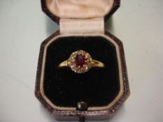 A Ruby and Diamond Cluster Ring in 18ct gold