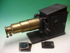 A Brass and Tinplate Magic Lantern with rackwork focusing, condenser and reflector, early electric