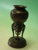 A Japanese Bronze Vase Meiji. Decorated in relief with birds and prunus raised on mythical beast