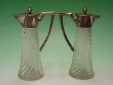 A Pair of French Carafons Wrythen moulded bodies with silver mounts and handles. 7 ½
