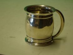 A Silver Mug of bulbous form with crescent handle. 2 ¼