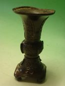 A Japanese Bronze Vase. Meiji. With flared rim, decorated with spiral roundels and animals, raised