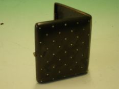 A Gun Metal Cheroot Case. Each face set with 41 old cut diamonds, gem set button. Early 20th