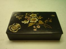 A lacquer Snuffbox decorated with flower spray and flying insect. Bears armorial 