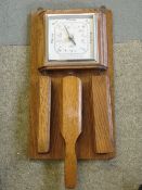 An Oak Aneroid Barometer. Shortland Smiths. Fitted with three clothes brushes. 15