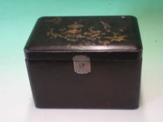 A Japanese Lacquer Tea Caddy. The lid decorated with birds and prunus, enclosing a pair of caddies