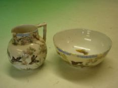 An Oriental Jug and Bowl decorated with landscape, birds and prunus. The bowl 5 ¼