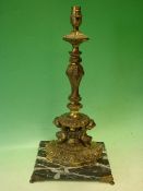 A Gilt Brass Table Lamp. Neo-classical form, raised on a marble base and paw feet. 17