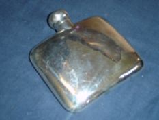 A Silver Hip Flask of curved form with locking hinged lid. 4 ½