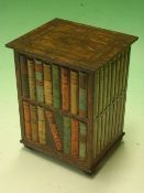 A Huntley and Palmers Biscuit Tin formed as a bookcase with volumes. 6 ¼