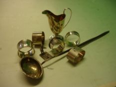 Miscellaneous Silver Viz. A cream jug, five napkin rings, a toddy ladle and a menu holder. 5ozs