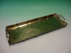 An Arts and Crafts Brass Tray chased with vine fruits. 19 ½