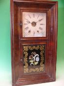An American Wall Clock. Weight driven movement, mahogany veneered case. 30