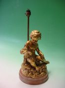 A Gilt Plaster Cherubic Table Lamp raised on a hard stone stepped base. 12