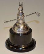 Silver rabbit trophy -showing a rabbit holding a golf club mounted on square mesh golf ball and