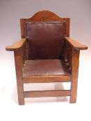 An Arts and Crafts Child's Armchair In the manner of Gustav Stickley with break arch top rail, the