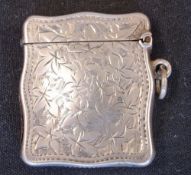 A Silver Vesta Case Of shaped form and engraved with leaves and initials to a cartouche. 1 ¼