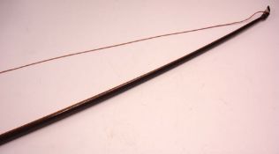A Victorian English Longbow Constructed from two hardwoods, with velvet grip. 63 ½