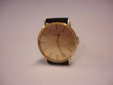 A 9ct Bulova Gentleman's Wristwatch The brushed gold dial with baton numerals. Manual wind. Bulova