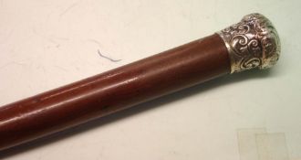 A Victorian Yew Walking Cane The silver grip repousse decorated with scrolling foliage and pricked