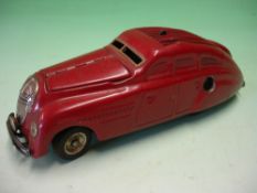 A Schuco Kommando Anno 2000 Voice activated clockwork motor. Maroon paint. 5 ½