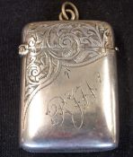 A Silver Vesta Case Of cushion form, engraved with foliage and initials RJW. 2