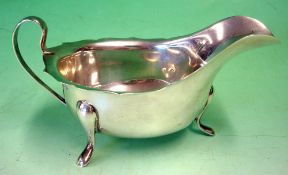 A Silver Sauce Boat Of helmet form with shaped rim. 5