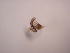 A Dress Ring Set with six white stones in a Deco style. In 9ct gold. Condition report: All good