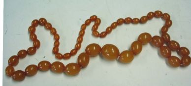An Amber Necklace Of graduated beads. 50g Condition report: All good, re-strung