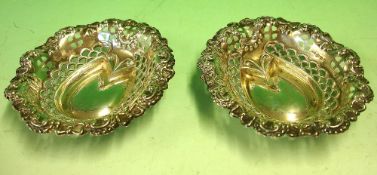 A Pair of Silver Bonbon Dishes With embossed and pierced decoration. 3 ¾