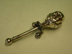 A Silver Rattle In typical form of head with bells, the handle with engraved inscription 