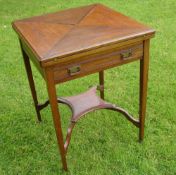 An Edwardian Mahogany Card Table The envelope top over a channel moulded frieze drawer, raised on