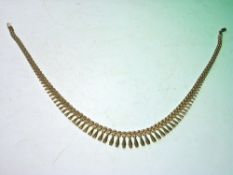 An Italian Gold Necklace The links hung with graduated pendant drops. Marked 9KT. 15.2g. Condition