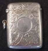 A Silver Vesta Case Engraved with scrolling foliage, a vacant cartouche to one side. 2
