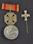 Third Reich Medals to include a lapel pin for the Stalingrad vets, silver plate on tomback bronze